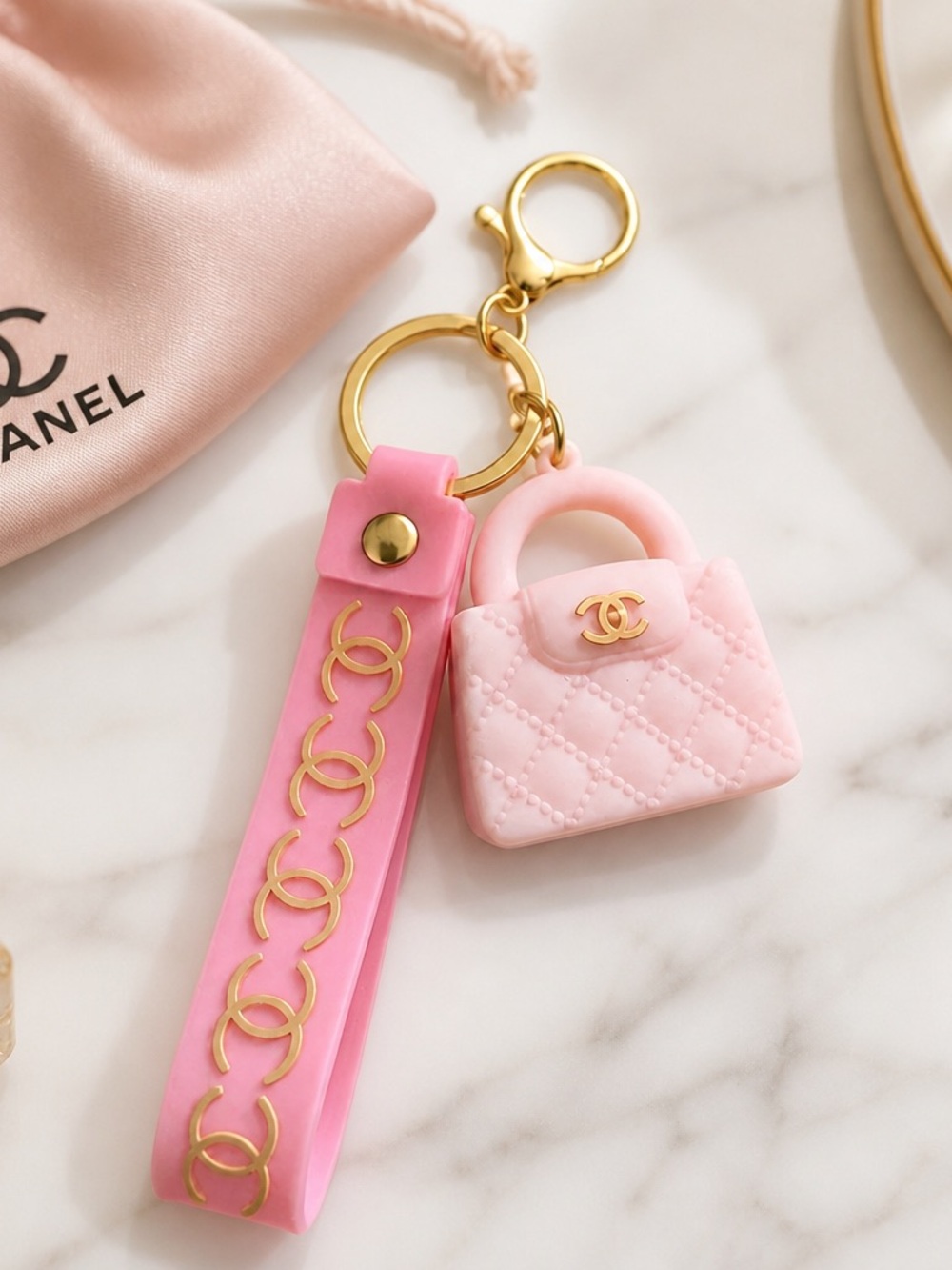 CHANEL Pink Quilted Mini Purse Keychain with Gold Hardware